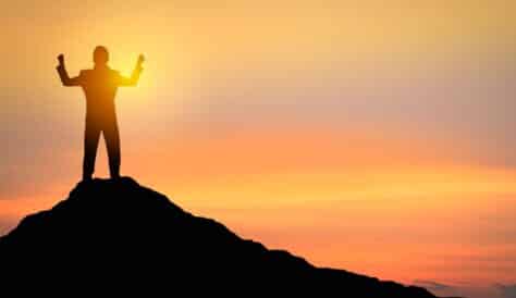 man stood on mountain top